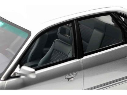 Silver Audi S4 model car door and front seats through side window