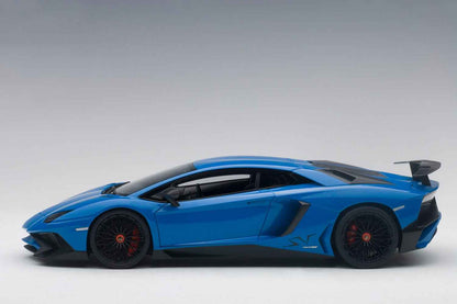 Blue 1:18 scale die-cast sports car, side profile view