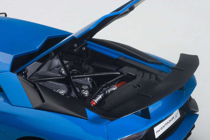 Blue sports car model with detailed engine compartment and carbon-style panels