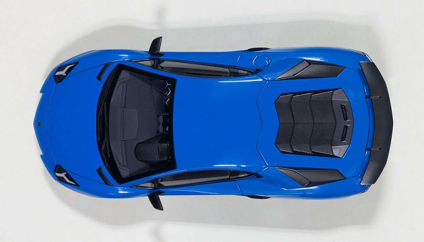 Blue 1:18 scale die-cast sports car, top-down view with roof vents