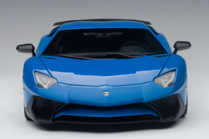 Blue 1:18 scale die-cast sports car, front view with headlights