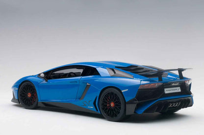 Blue 1:18 scale die-cast sports car, rear-left three-quarter view