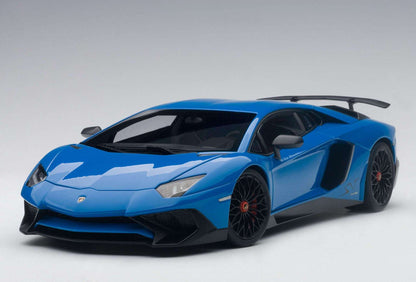Blue sports car model front three-quarter view with black grille and splitter