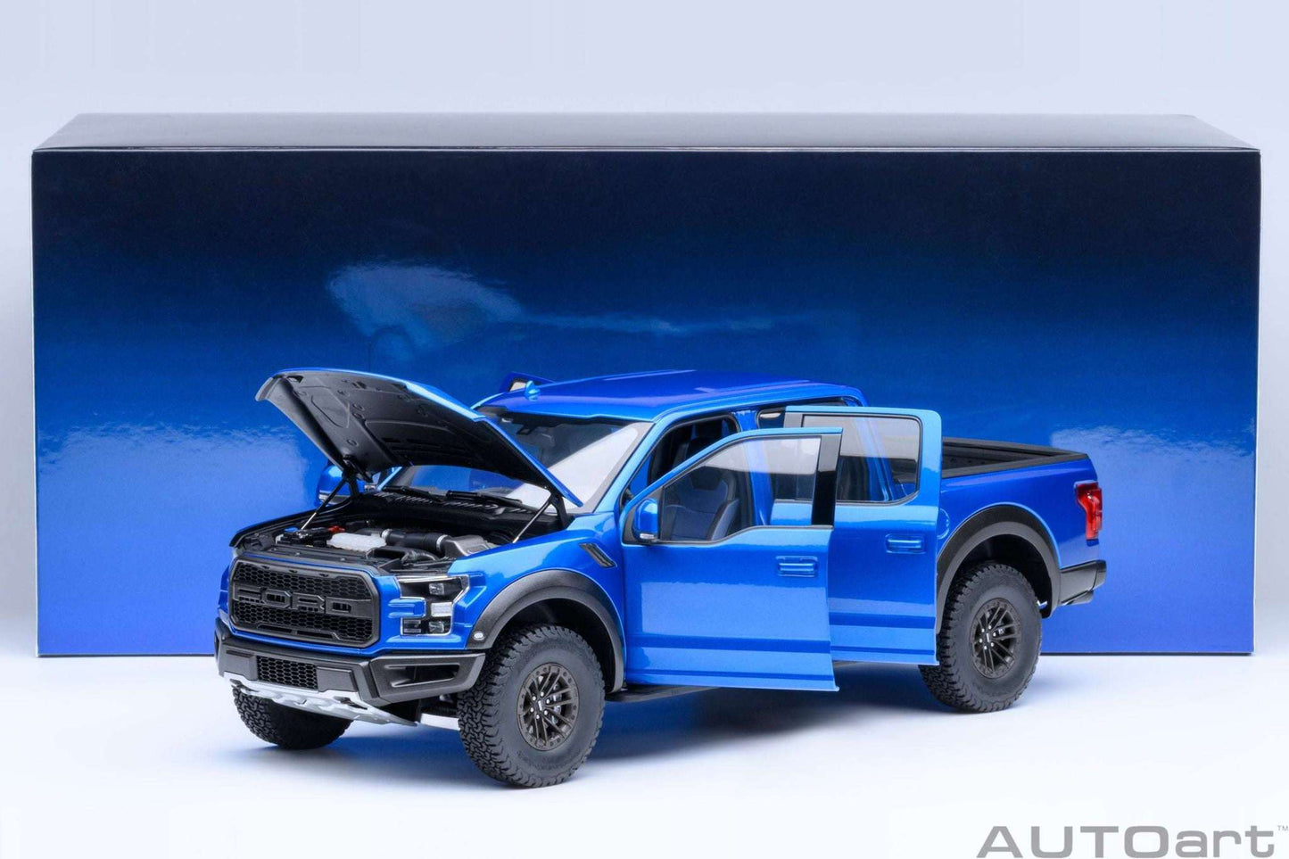 1:18 scale blue pickup truck exterior with hood open and detailed wheels