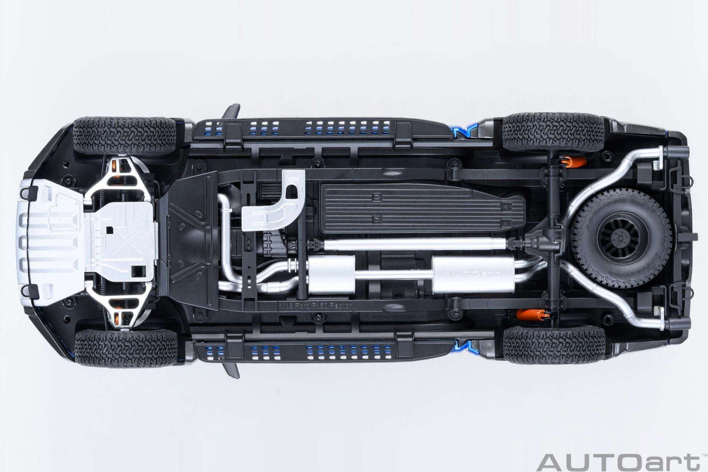 Pickup truck model underside with exposed chassis components and suspension detail