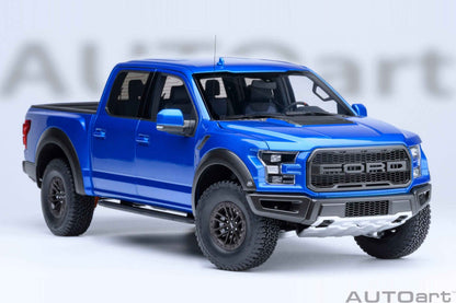 Blue pickup truck model with black grille and front bumper detail, three-quarter front view