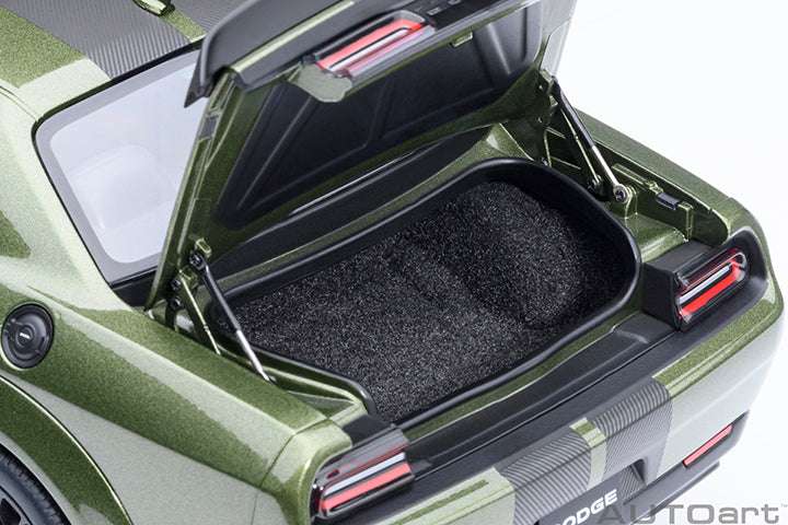 Green 1:18 die-cast sports car with trunk area open, dark textured interior