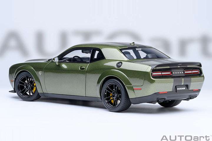 Green 1:18 scale Dodge Challenger model car rear 3/4 view with dual exhaust.