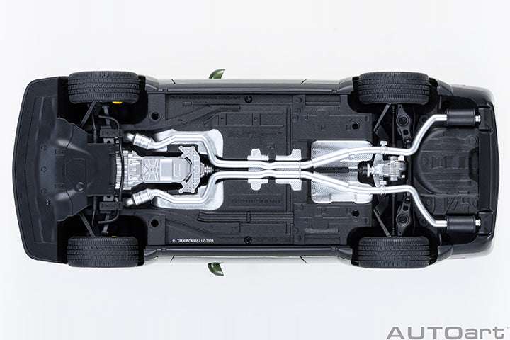 Undercarriage view of a green 1:18 scale Dodge Challenger model car chassis.