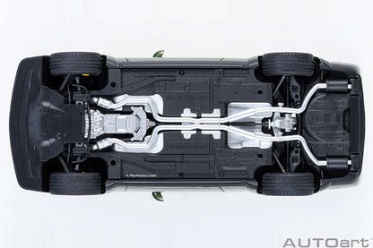 Undercarriage view of a green 1:18 scale Dodge Challenger model car chassis.