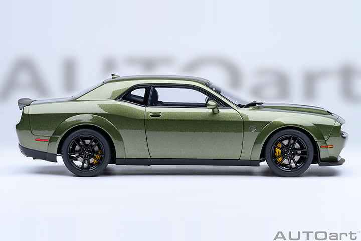 Green 1:18 scale Dodge Challenger model car angled side view with hood vents.
