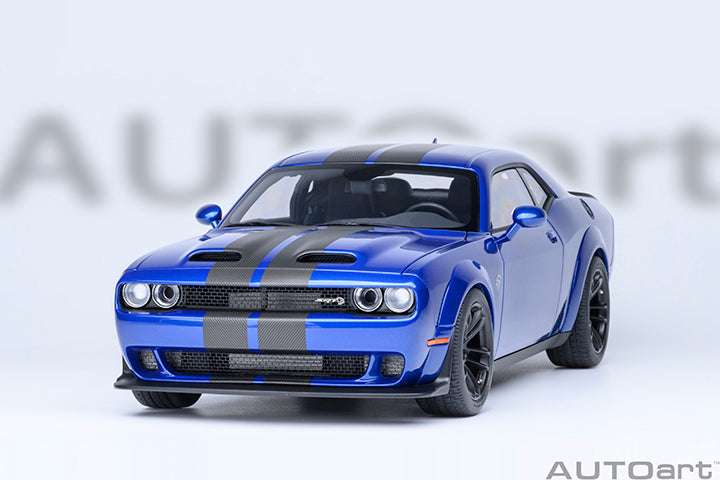 Blue die-cast sports car front view with black hood stripes, grille, and round headlights.