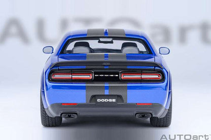 Rear view die-cast sports car model in indigo blue with red taillights and “DODGE” badge