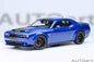 Indigo blue die-cast sports car model with black hood vents and front grille details