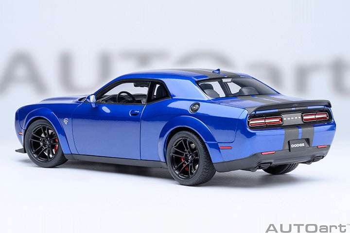 Indigo blue rear three-quarter die-cast sports car model with dual exhaust and taillights