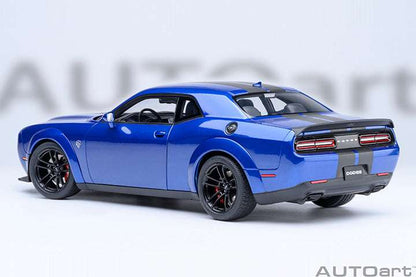 Indigo blue rear three-quarter die-cast sports car model with dual exhaust and taillights