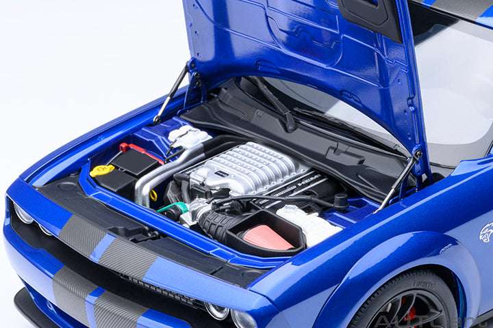 Blue die-cast sports car with hood open, showing detailed engine components.