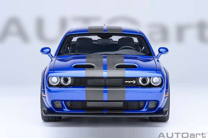 Front view die-cast sports car model in indigo blue with twin headlights and black grille