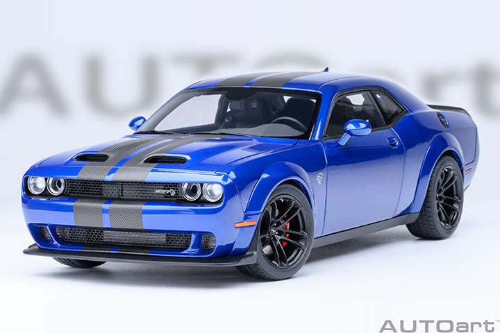 Blue die-cast sports car front-left view with black hood stripes, grille, and headlights.