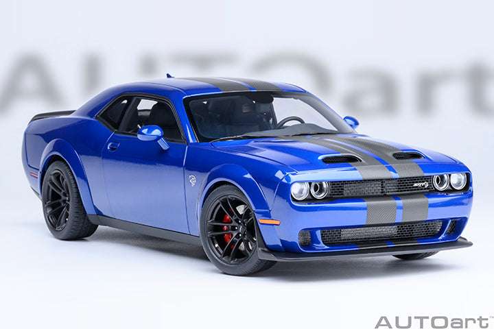 Blue die-cast sports car front three-quarter view with black hood stripes and chrome grille.