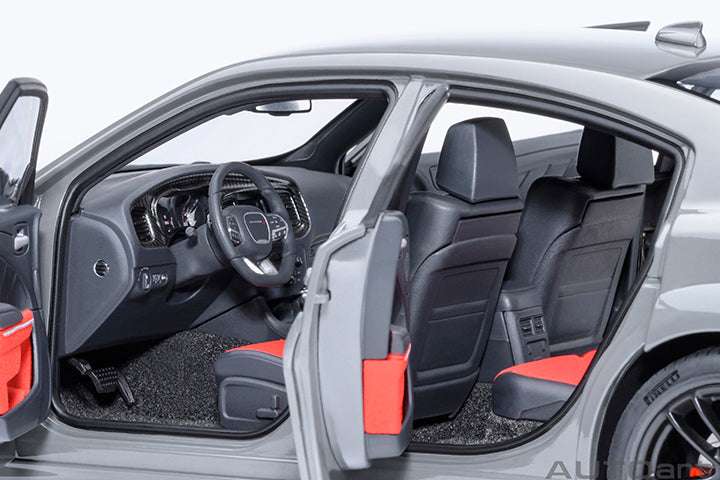 Dodge Charger widebody die-cast model car interior, black seats with red inserts.
