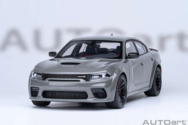 Gray die-cast Charger model front view with aggressive grille, splitter, and dark headlights.
