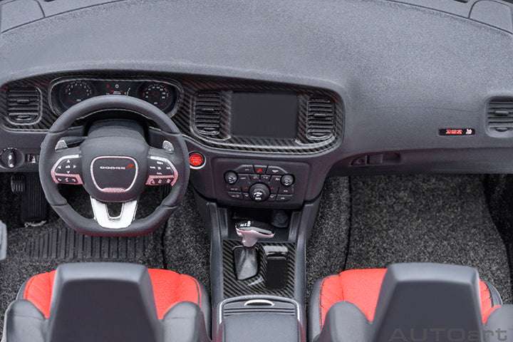 Interior view of gray die-cast Charger model with red-and-black seats and steering wheel.