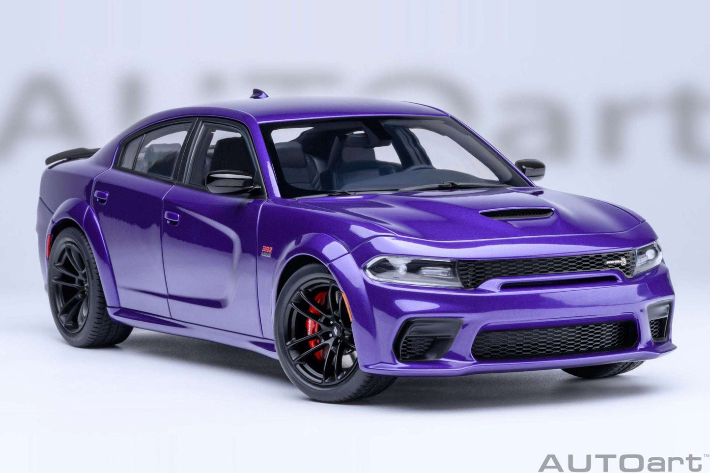 Purple die-cast muscle car front 3/4 view with black grille and red brake calipers