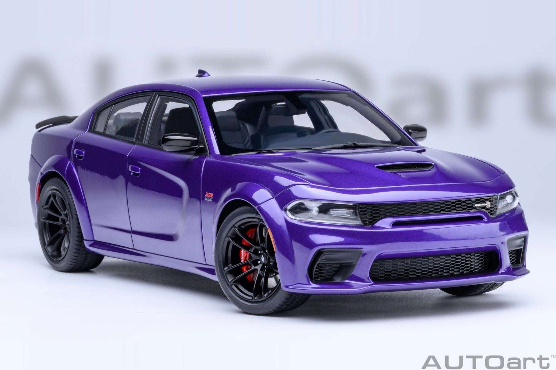 Purple die-cast muscle car front 3/4 view with black grille and red brake calipers