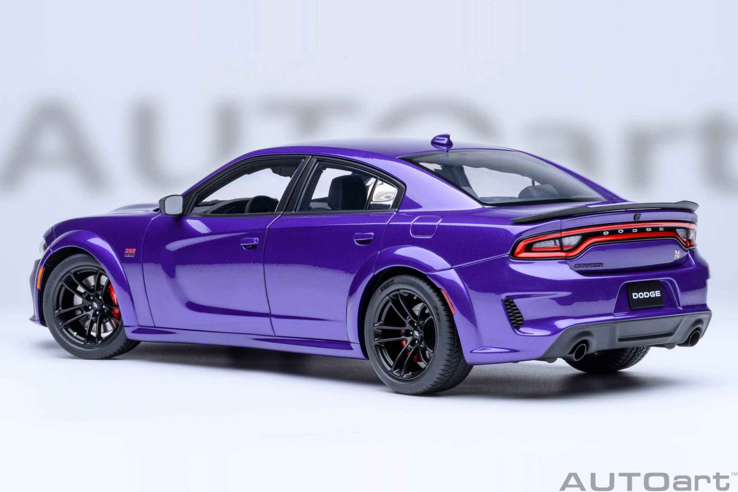 AUTOart 1:18 scale purple Dodge Charger model, rear three-quarter view