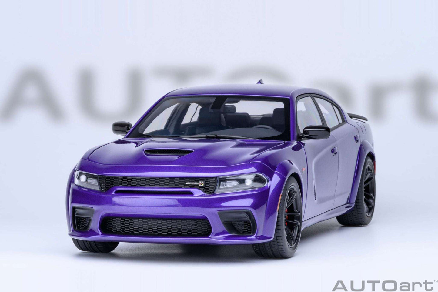 Purple die-cast muscle car front view with black grille and detailed headlights