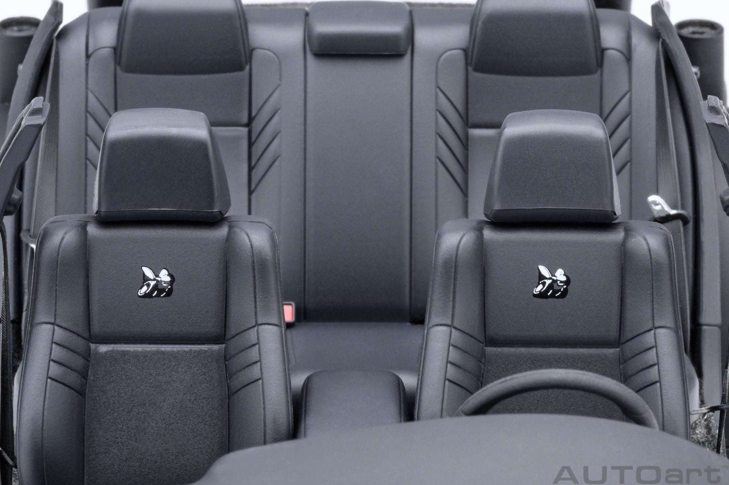 Purple die-cast muscle car interior seats with black upholstery and headrests