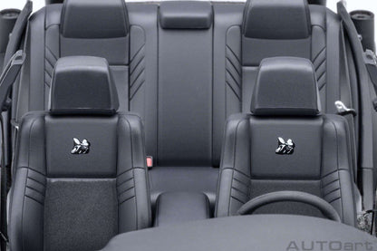 Purple die-cast muscle car interior seats with black upholstery and headrests