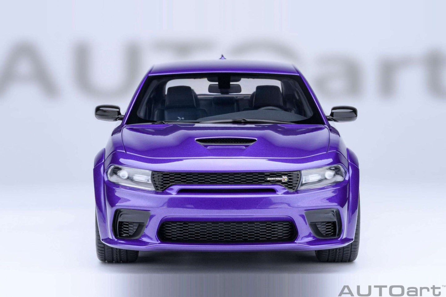 AUTOart 1:18 scale purple Dodge Charger model, front view with grille and lights