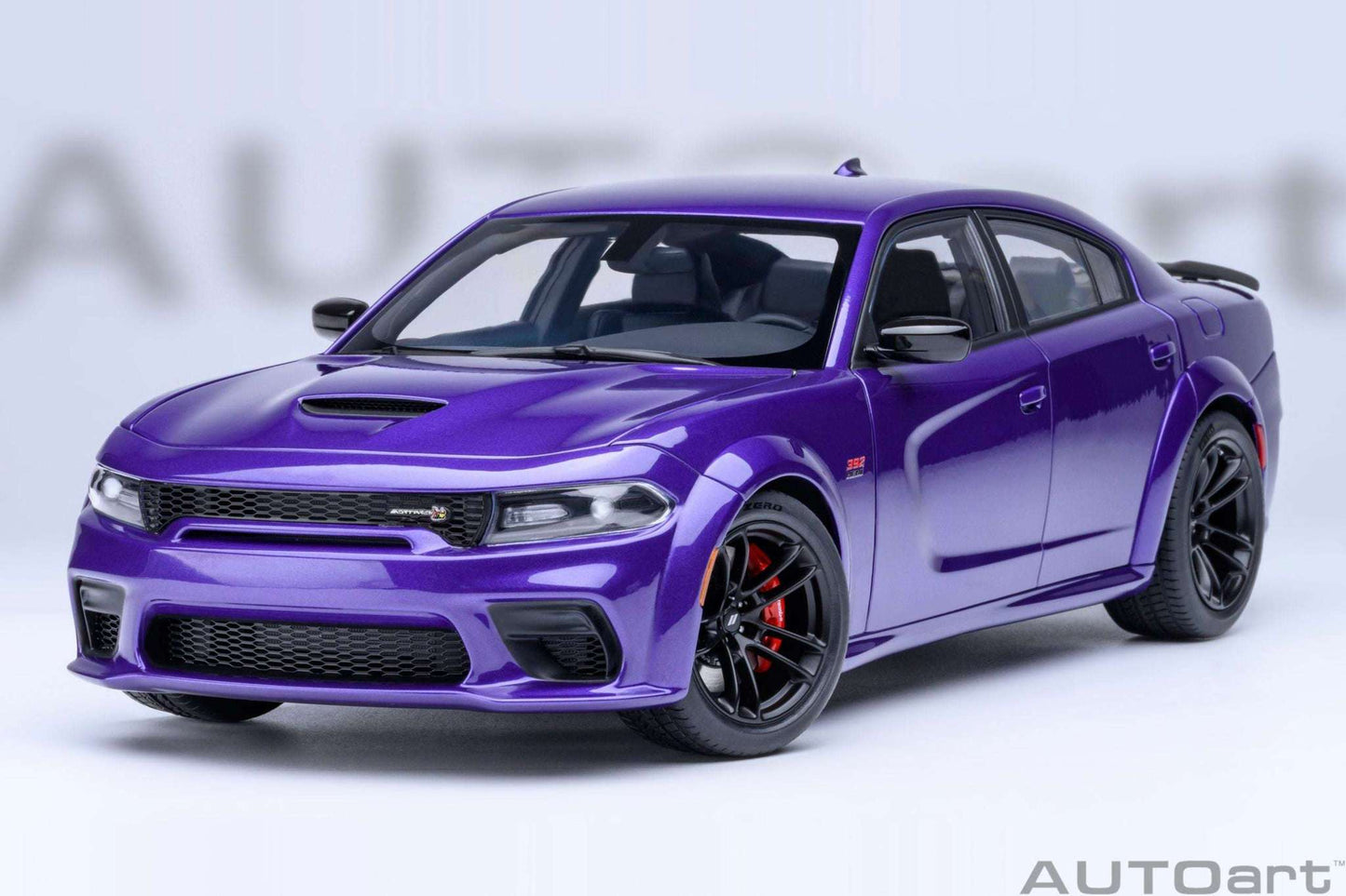 Purple die-cast muscle car front 3/4 view with hood vents and black wheels