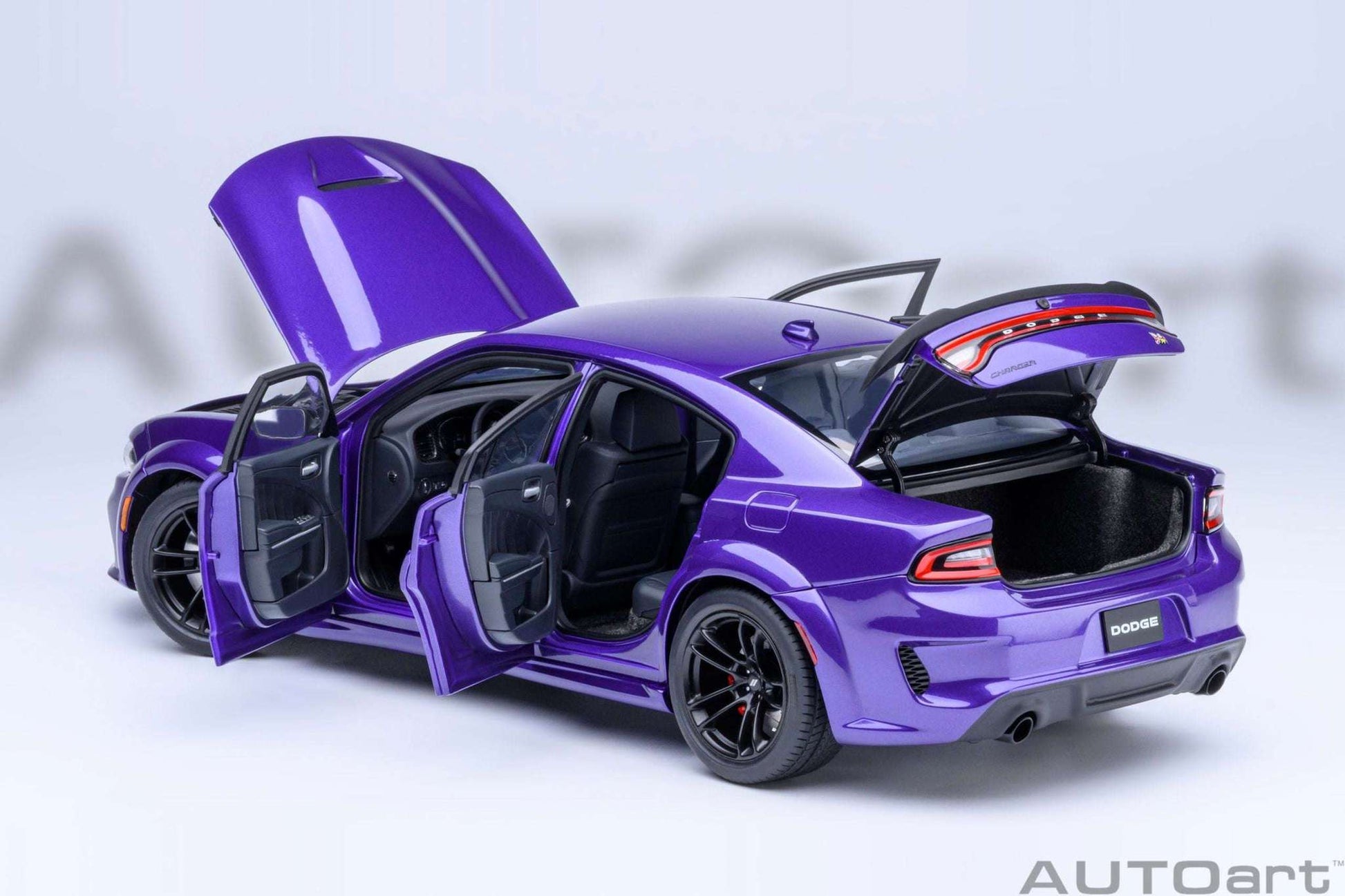 Purple die-cast muscle car with doors open and hood raised, black interior visible