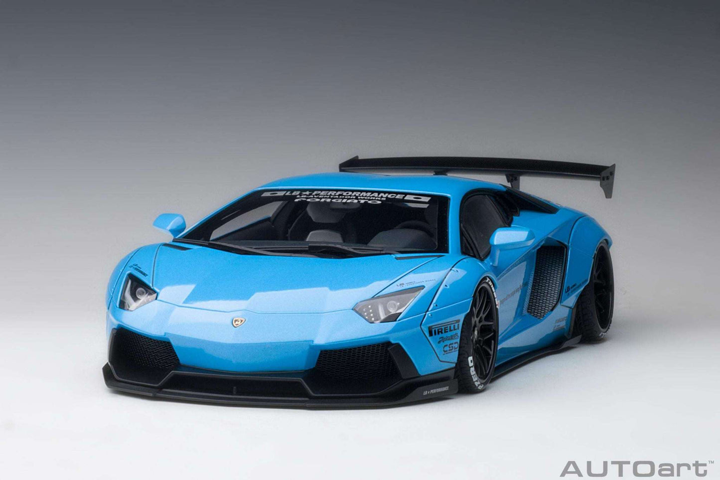 Sky blue 1:18 Lamborghini Aventador model car with black front splitter and side vents