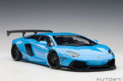 Metallic sky blue Lamborghini sports car model with black wheels, front side view, rear spoiler