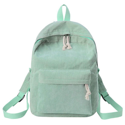 Mint green backpack with tassel drawstring, front zip pocket, and adjustable shoulder straps