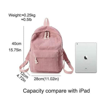 Pink mini backpack with front pocket, top handle, and adjustable shoulder straps