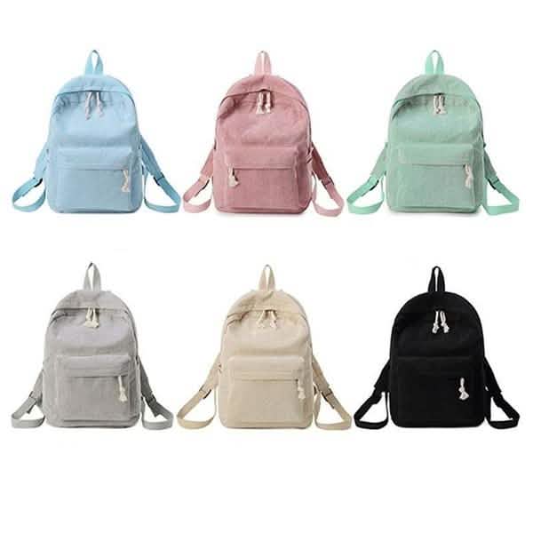 Assorted mini backpacks in blue, pink, green, gray, beige, and black