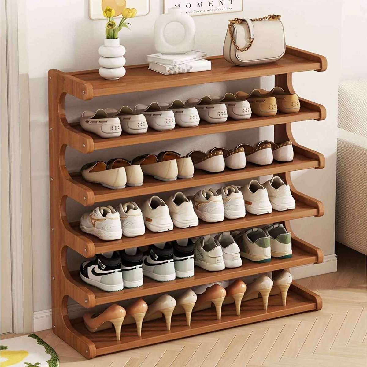 Bamboo shoe rack organizer with multiple wide tiers and curved shelf edges, mixed shoes