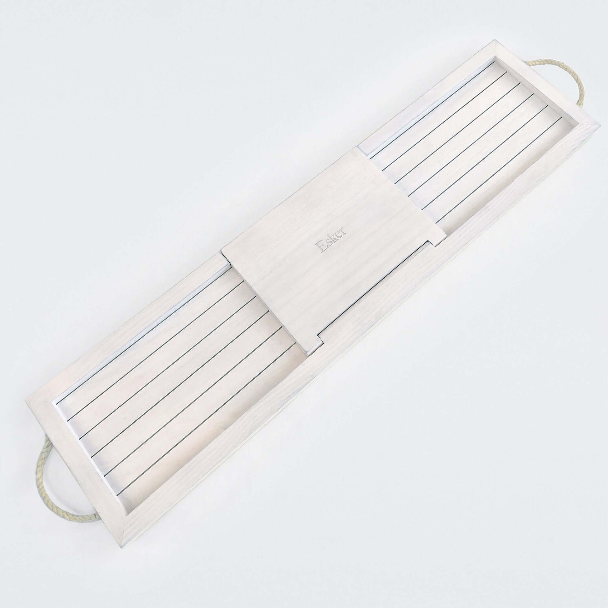 White wooden bath board with long slats, centered brand mark, and loop handle