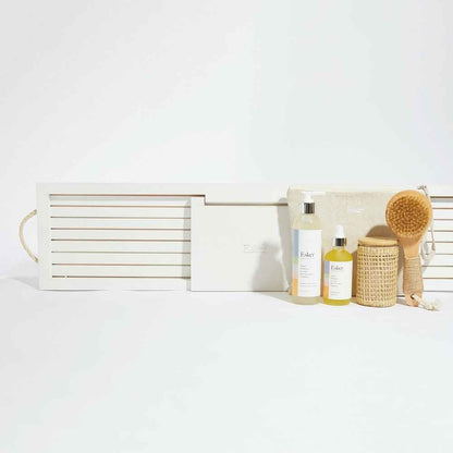 White wooden bath board with hinged design and slatted interior compartment