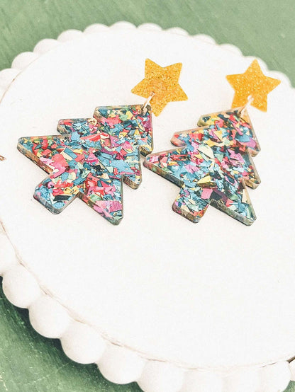 Pair of acrylic Christmas tree earrings with confetti print and gold glitter stars