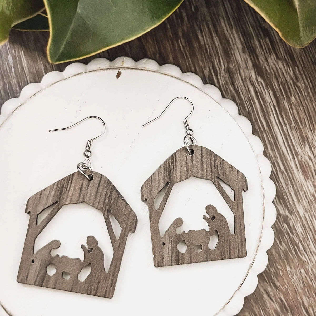 Nativity scene dangle earrings with dark wood stable silhouettes