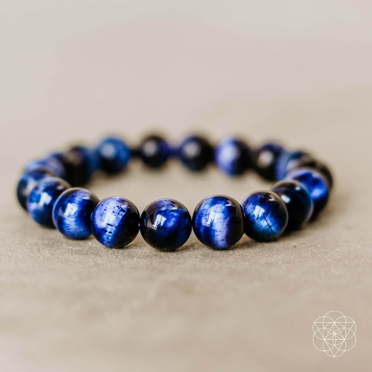 Blue and black beaded bracelet with glossy round stones in a simple strand