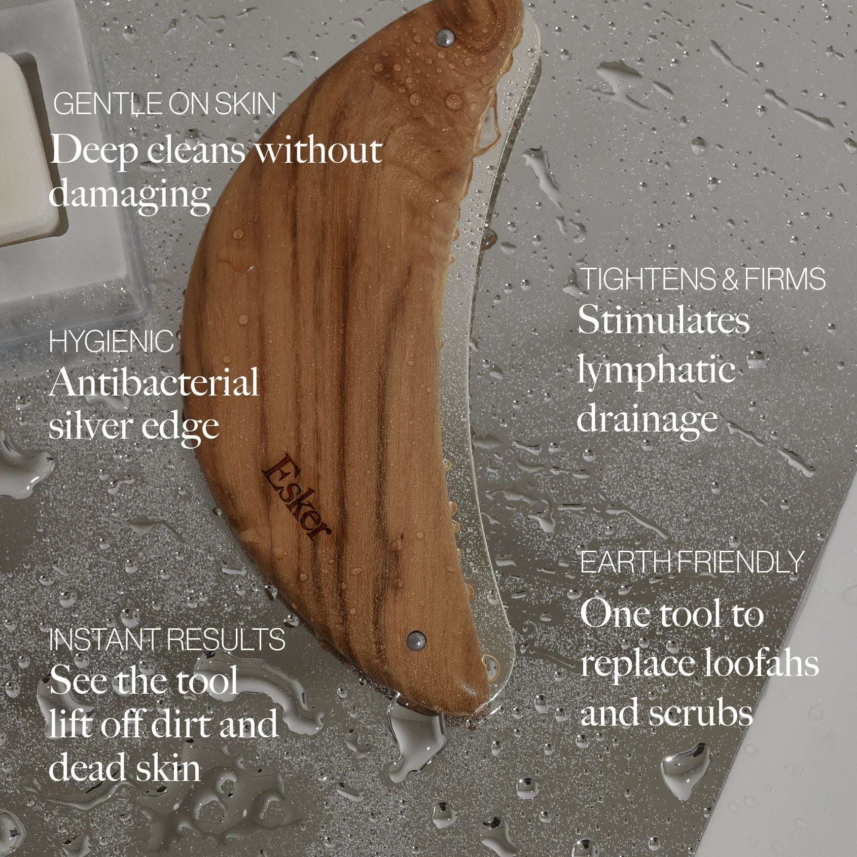 Wooden exfoliation blade on wet skin with water droplets