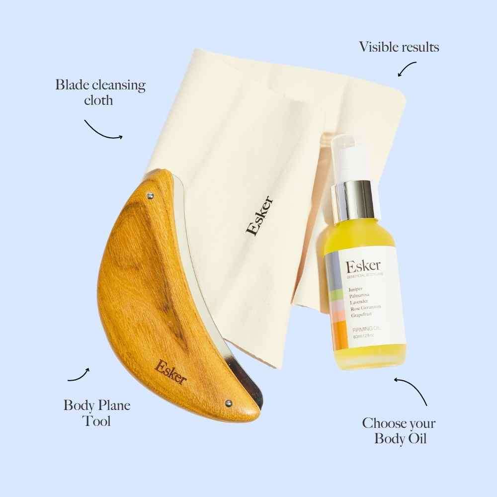 Body exfoliation tool with wooden blade, cleaning cloth, and body oil bottle