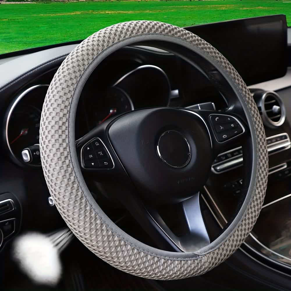 Breathable mesh steering wheel cover in light gray with textured grip and snug fit